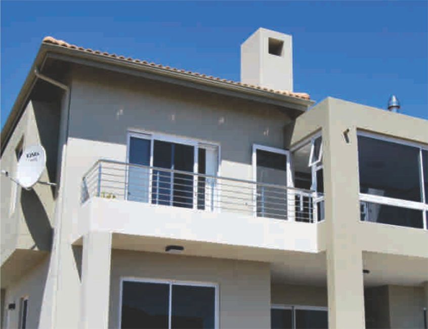 Aluminium windows on a double-storey house by Prinro Aluminium